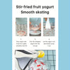 A stainless steel rolled ice cream maker is shown with a glass bowl filled with fruit yogurt and ice skating ingredients.