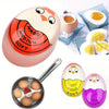 A silicone egg cooking timer with markings for hard, medium, and soft eggs, shown next to cooked eggs.