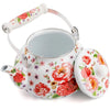 A white enamel teapot with a pink floral pattern and a light pink handle.