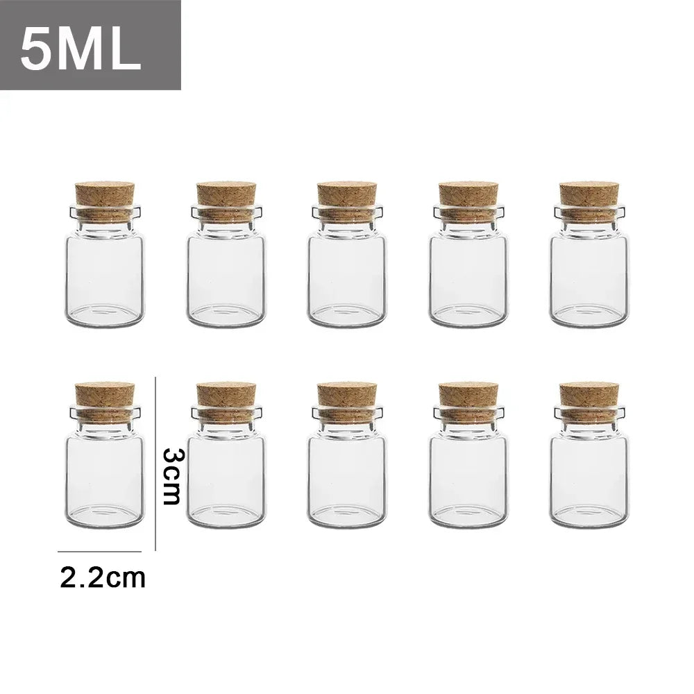 A set of five small glass bottles with cork stoppers and a 5ML capacity label.