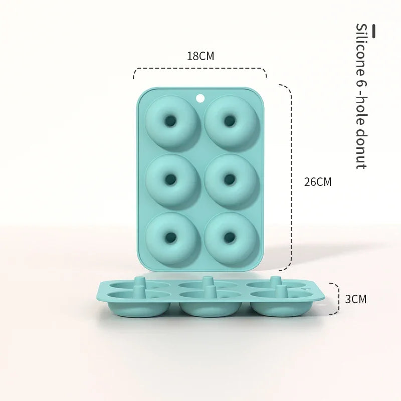 A teal silicone baking mold set featuring six round donut-shaped cavities and a tray for multiple items.