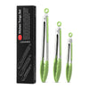 A set of three stainless steel kitchen tongs with green silicone grips displayed in a black box.
