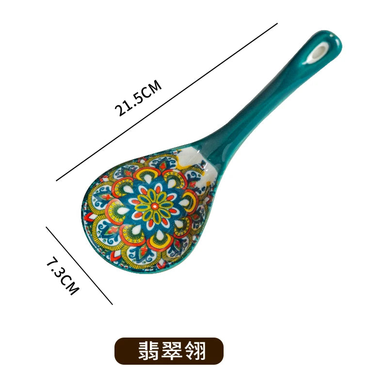 A teal ceramic ladle with a decorative floral pattern, shown with dimensions 21.5cm and 7.3cm.