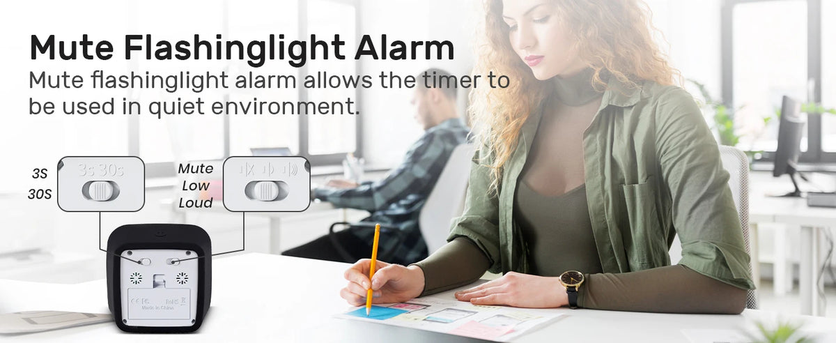 A woman is using a mute flashlight alarm timer on a desk, demonstrating its use in a quiet environment.