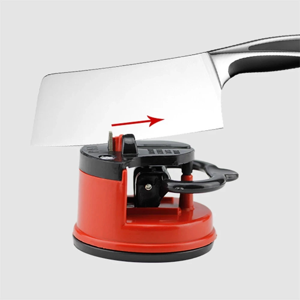 A professional suction knife sharpener with a silver blade and red base is shown.