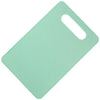 A light mint green plastic cutting board with a handle, shown from above.