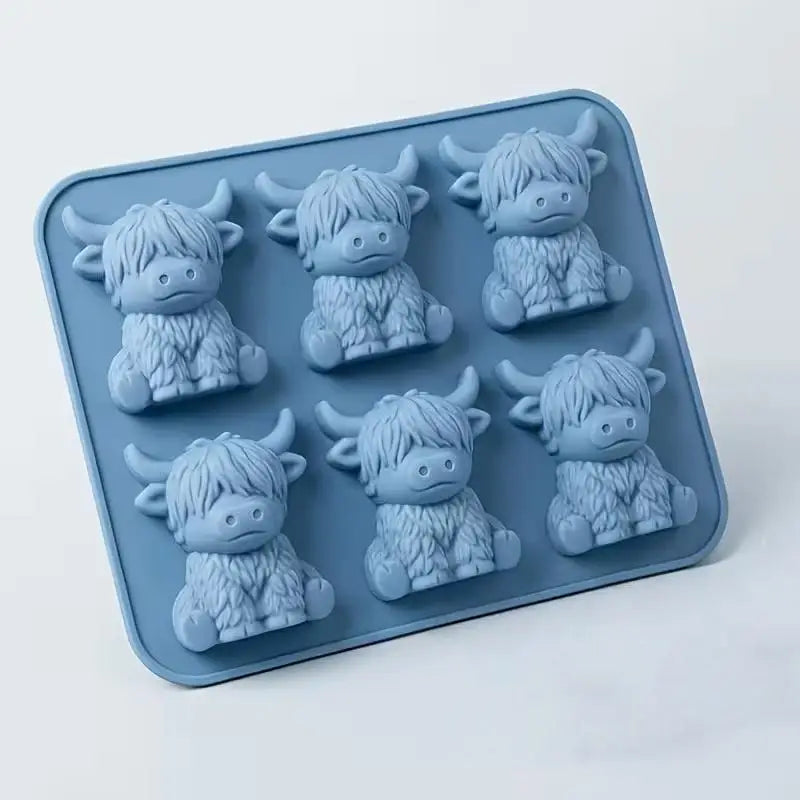 A silicone ice cube mold featuring multiple small, furry creature shapes for whiskey and coffee