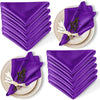 A set of ten purple satin dinner napkins folded and displayed on a woven surface.