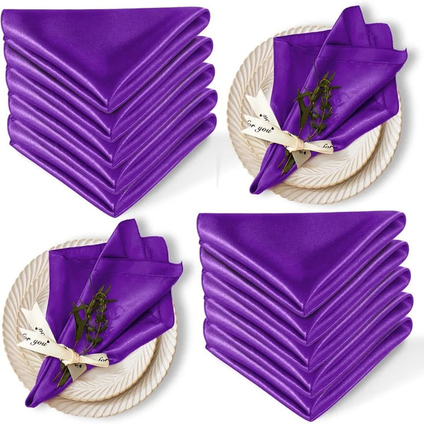 A set of ten purple satin dinner napkins folded and displayed on a woven surface.