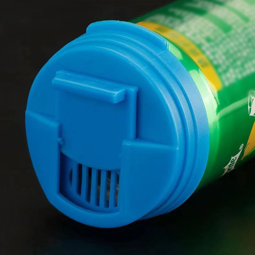 Close-up of a blue reusable leakproof soda can lid being removed from a green bottle.