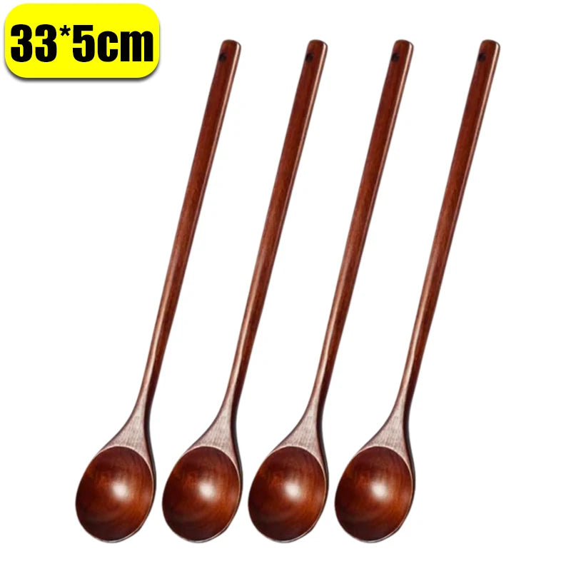 A set of four dark brown natural wooden serving spoons.