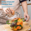 A hand is holding a large capacity borosilicate glass soup pot filled with vegetables and ingredients for a stewed diet.