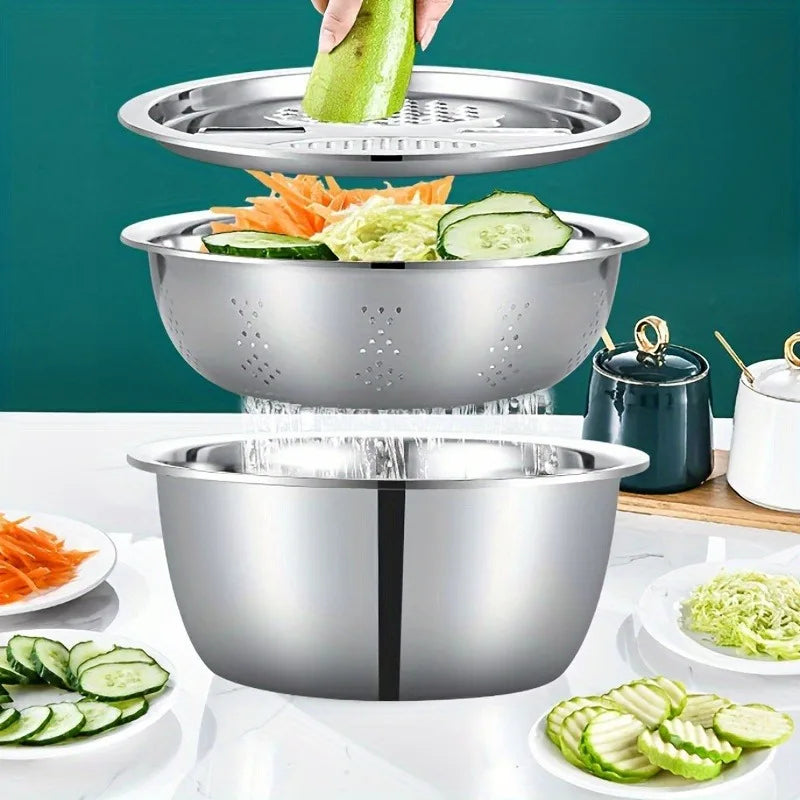 A three-piece stainless steel mixing bowl set with a strainer, grater, and a separate bowl, shown with fresh vegetables.