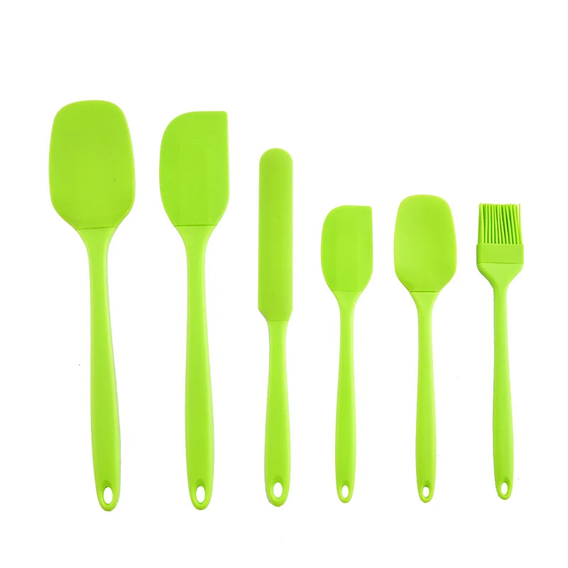 A set of six bright lime green silicone kitchen tools for baking and food preparation.