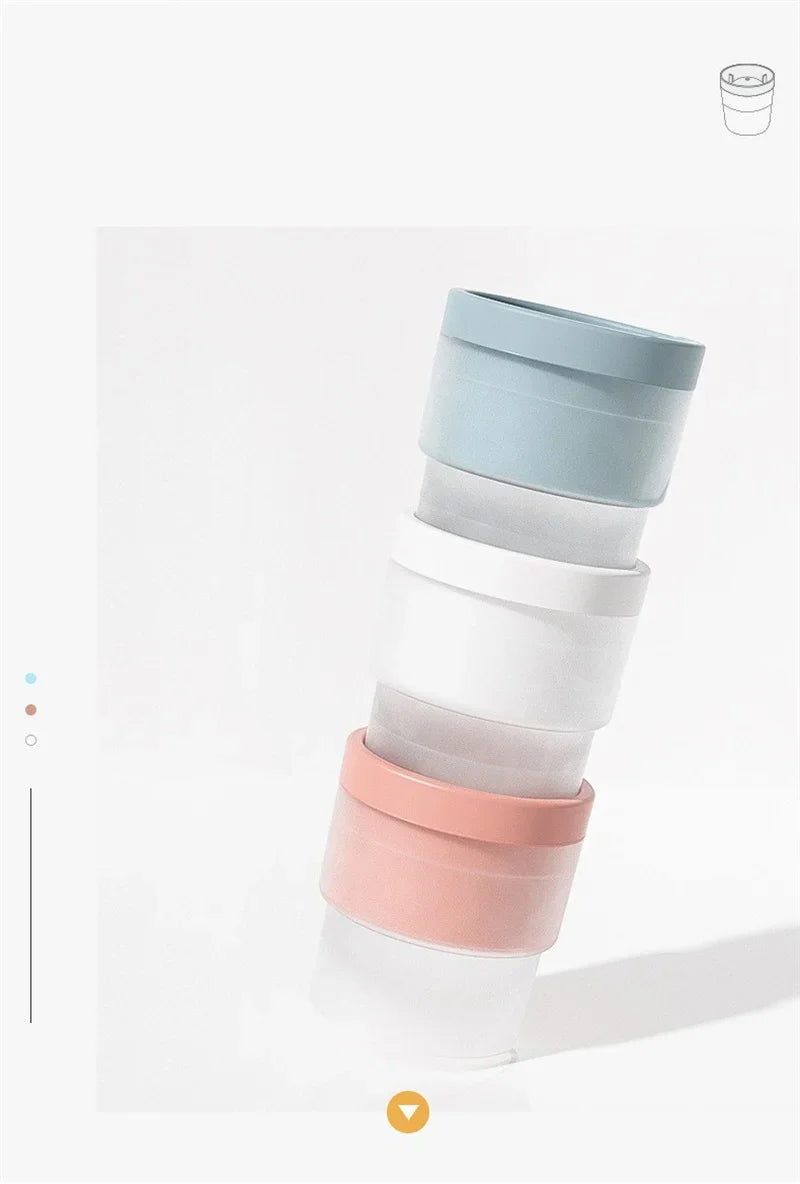 A stack of five food-grade ice molds in pastel colors, including light blue, white, and pink.
