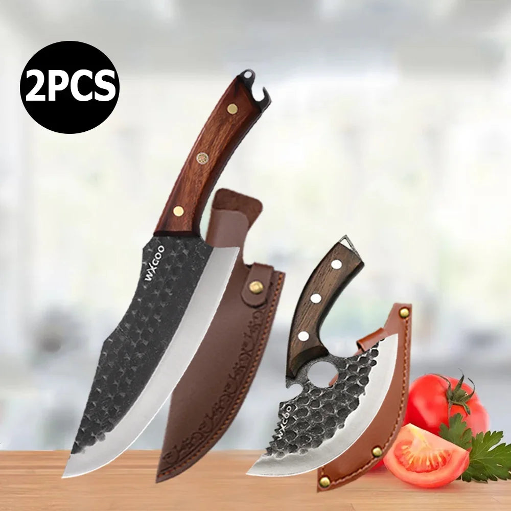 Two handmade forged chef knives with wooden handles displayed next to fresh tomatoes