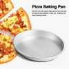 A round silver non-stick pizza baking pan shown next to slices of baked pizza.
