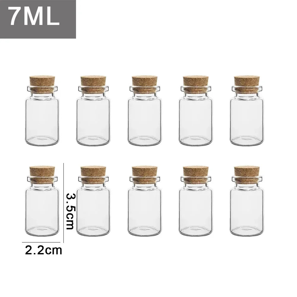 A set of seven small glass bottles with cork stoppers, used for messages or wishing.