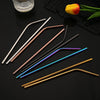 A set of six reusable stainless steel drinking straws in various colors, including gold, copper, silver, and blue.
