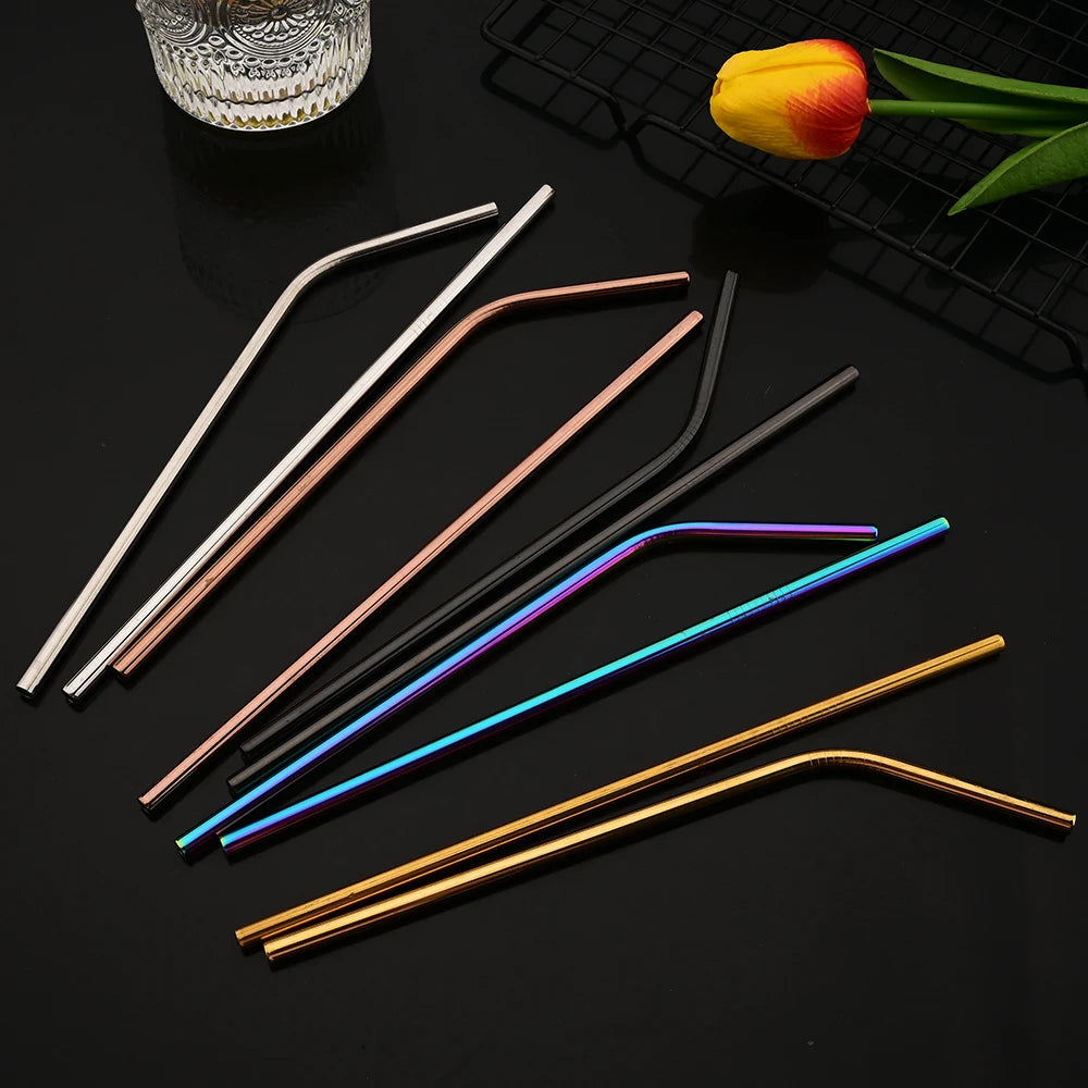 A set of six reusable stainless steel drinking straws in various colors, including gold, copper, silver, and blue.