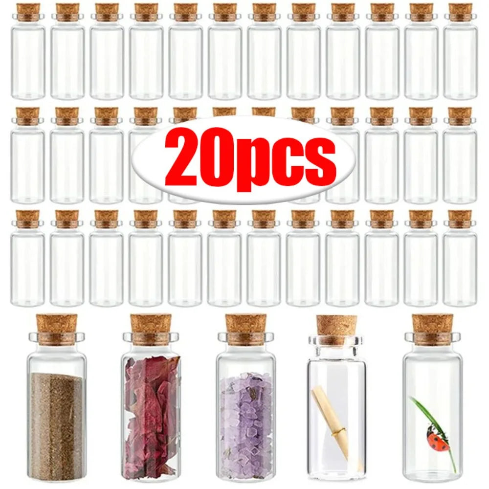 A set of decorative glass message and wishing bottles filled with various colored salts and herbs.