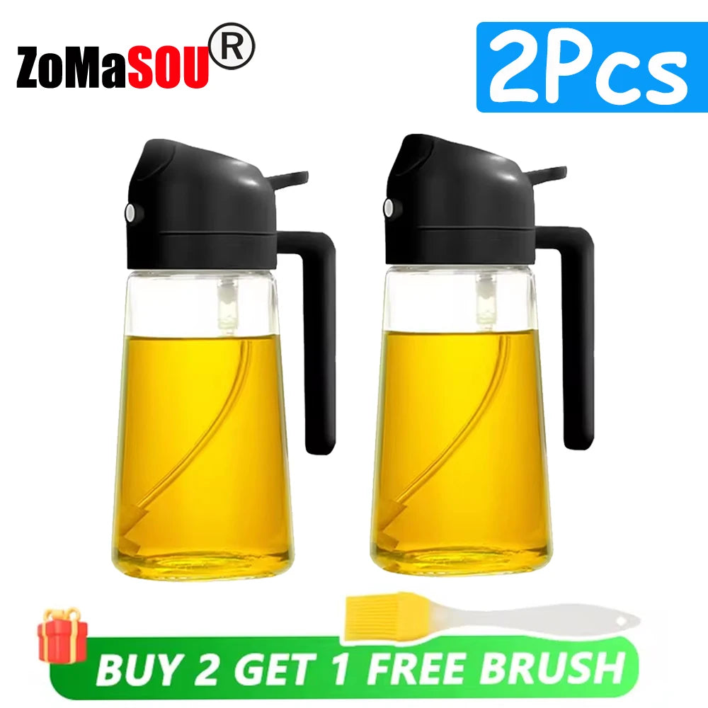 Two black glass oil sprayer bottles with yellow liquid and a free brush included
