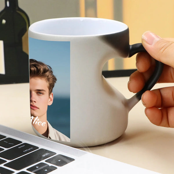 A white coffee mug with a black handle features a photo of a young man on the side.