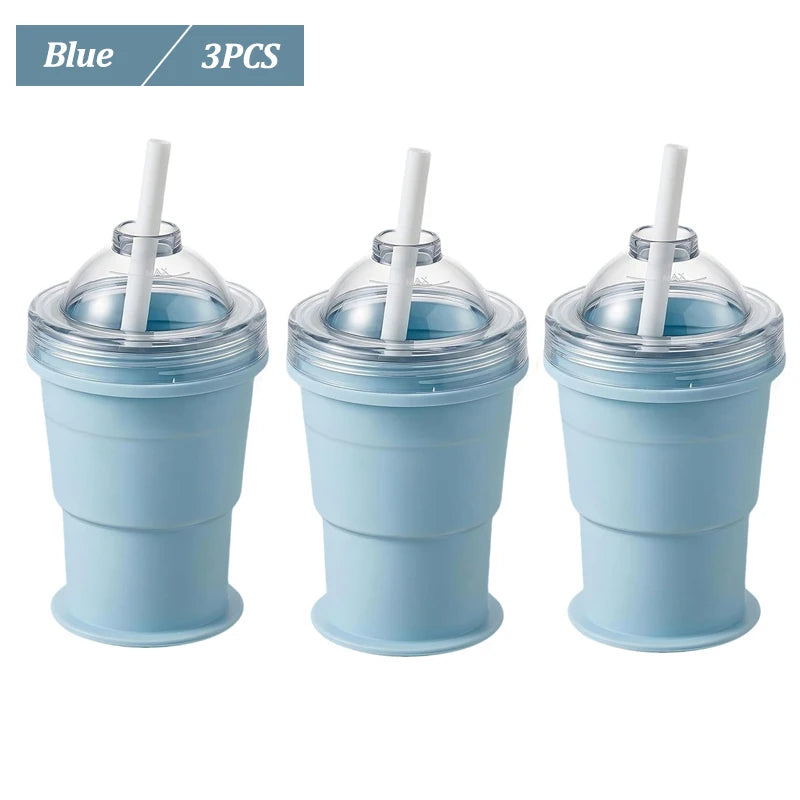 Three blue reusable silicone ice ball cups with straws
