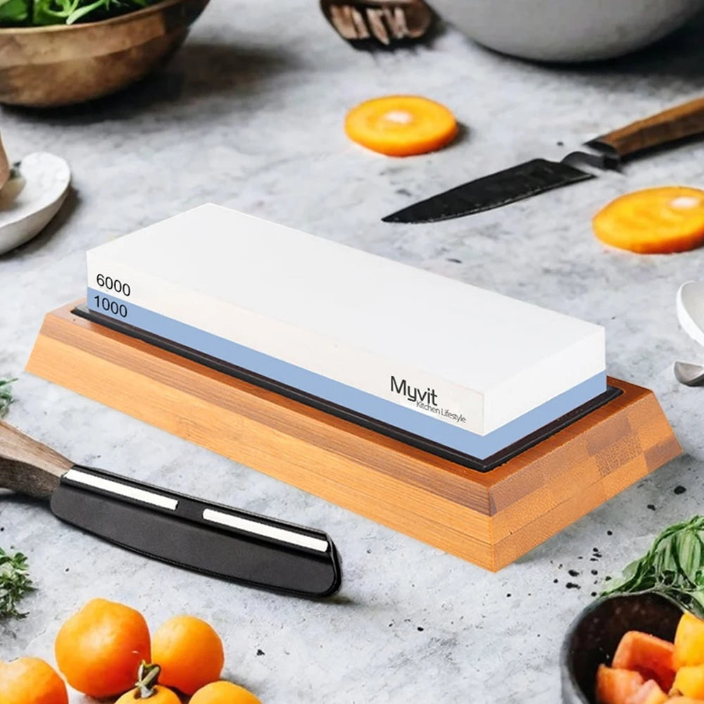A wooden knife sharpening stone set with a blade resting on it, surrounded by fresh produce.