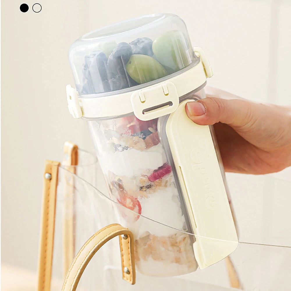 A hand holds a clear reusable container filled with overnight oats and snacks, displayed on a wooden rack.