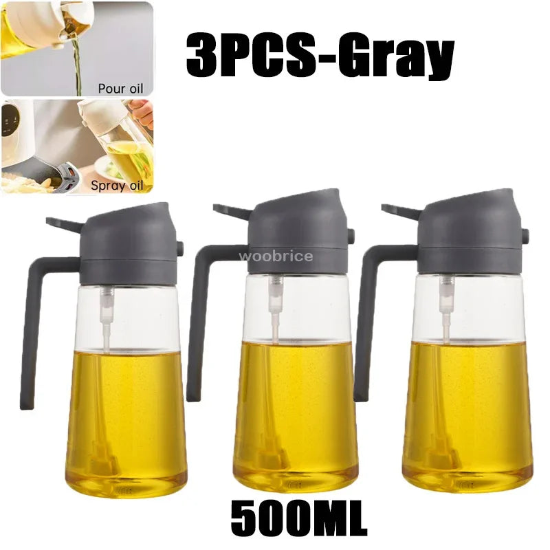 Three 500ml gray glass oil spray dispensers with black nozzles and pump mechanisms.