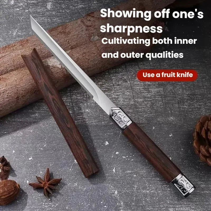 A stainless steel fruit knife with a dark wood handle is shown next to spices and a pine cone.