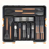 A black drawer organizer tray holding various wooden and silver cutlery and kitchen utensils.