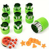A set of 12 stainless steel vegetable and fruit molds in bright green plastic containers.