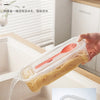 A hand is pouring noodles from a clear plastic container into a sink, demonstrating the use of a microwave noodle and salad c