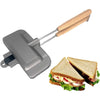 A silver sandwich maker with a wooden handle is shown next to a sandwich.
