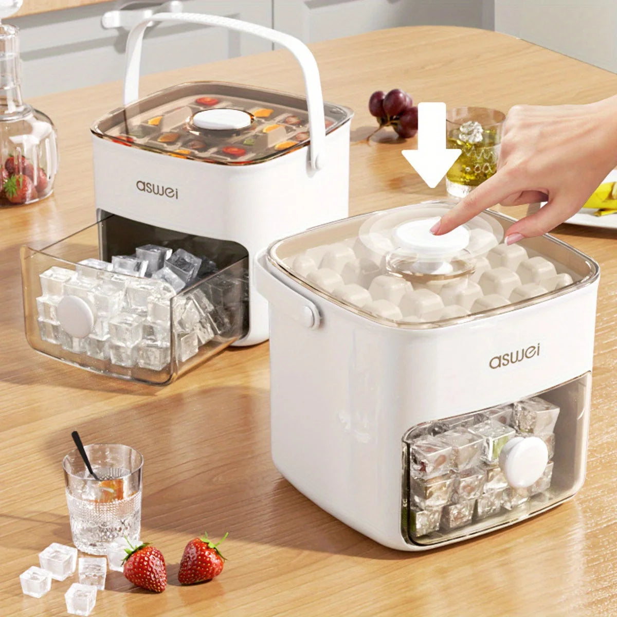 A white ice cube maker with a double layer design sits on a wooden table next to fresh strawberries and ice cubes.