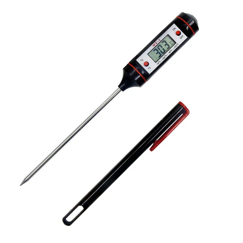 Sonda digital para carne y alimentos negra con punta roja mostrando una lectura de temperatura.