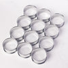 Six stainless steel nonstick baking rings arranged in a cluster on a white surface.