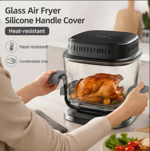 A person is holding a glass air fryer with a silicone handle cover, demonstrating the heat-resistant grip.