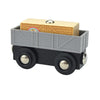 A wooden magnetic train car set featuring a gray box and black wheels.