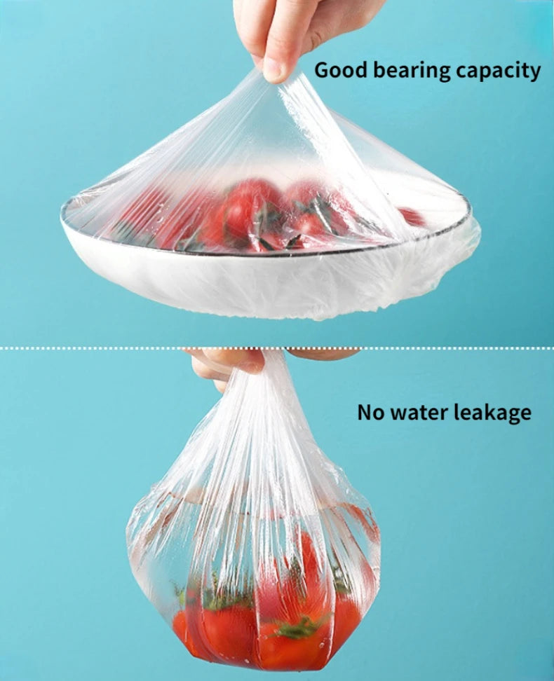 A hand is placing a clear plastic food cover over fresh strawberries, demonstrating good bearing capacity and no water leakag