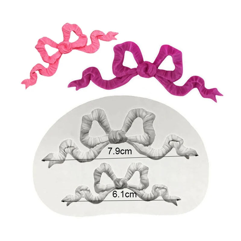 Pink and purple silicone baking molds shaped like bows and ribbons for chocolate cupcakes