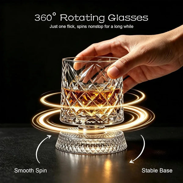 A hand holds a 360° rotating crystal whiskey glass, demonstrating a smooth spin on a stable base.