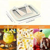 Stainless steel rolled ice cream maker with two scoops of ice cream and a smoothie in the background