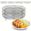 Stackable stainless steel grill rack for ovens and fryers shown in a stack on a white plate