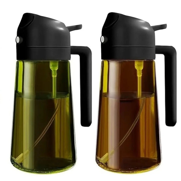 A black glass oil sprayer dispenser bottle with a gold-tinted liquid inside.
