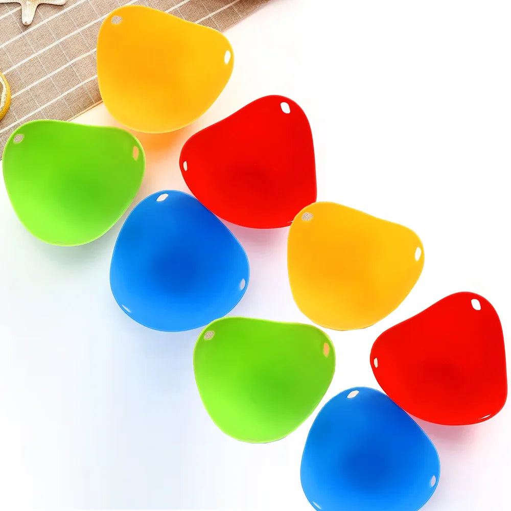 A collection of colorful silicone egg poacher molds in shades of orange, red, green, and blue.