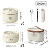 A set of portable stackable thermal lunch boxes in beige and brown, showing various sizes and components.
