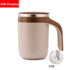 A beige ceramic mug with a brown handle and a silver base, featuring a USB charging mechanism.